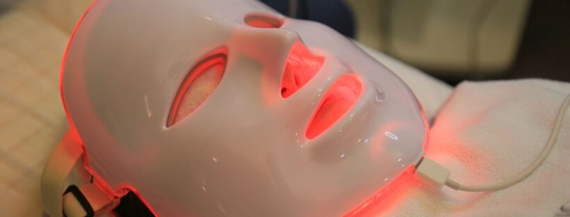 Close-up of an LED light therapy mask used for skincare and acne treatment