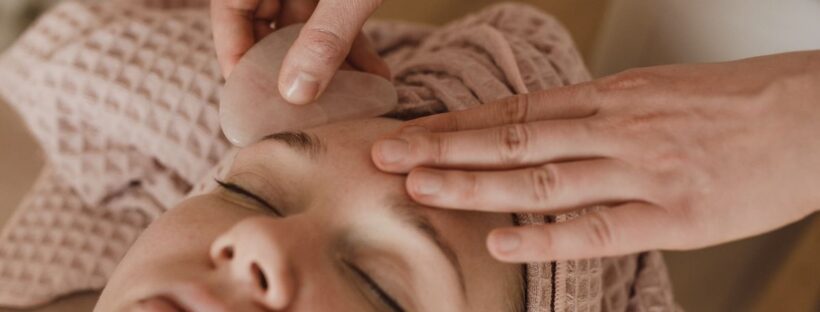 Woman receiving a relaxing facial skin treatment